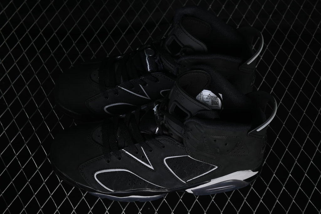 Angled view of the pair showing their black uppers and contrasting side details.