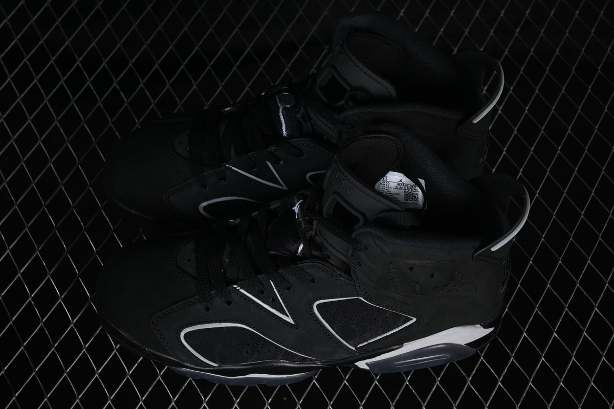 Angled view of the pair showing their black uppers and contrasting side details.