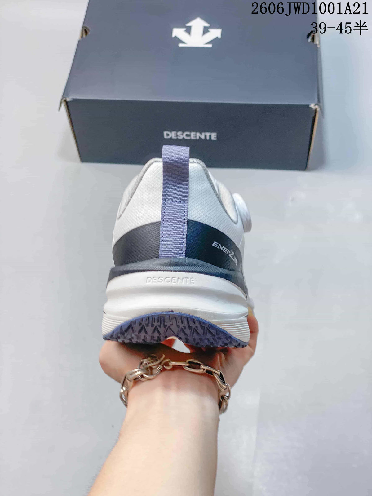 Rear view of a white DESCENTE sneaker showing the heel and outsole tread