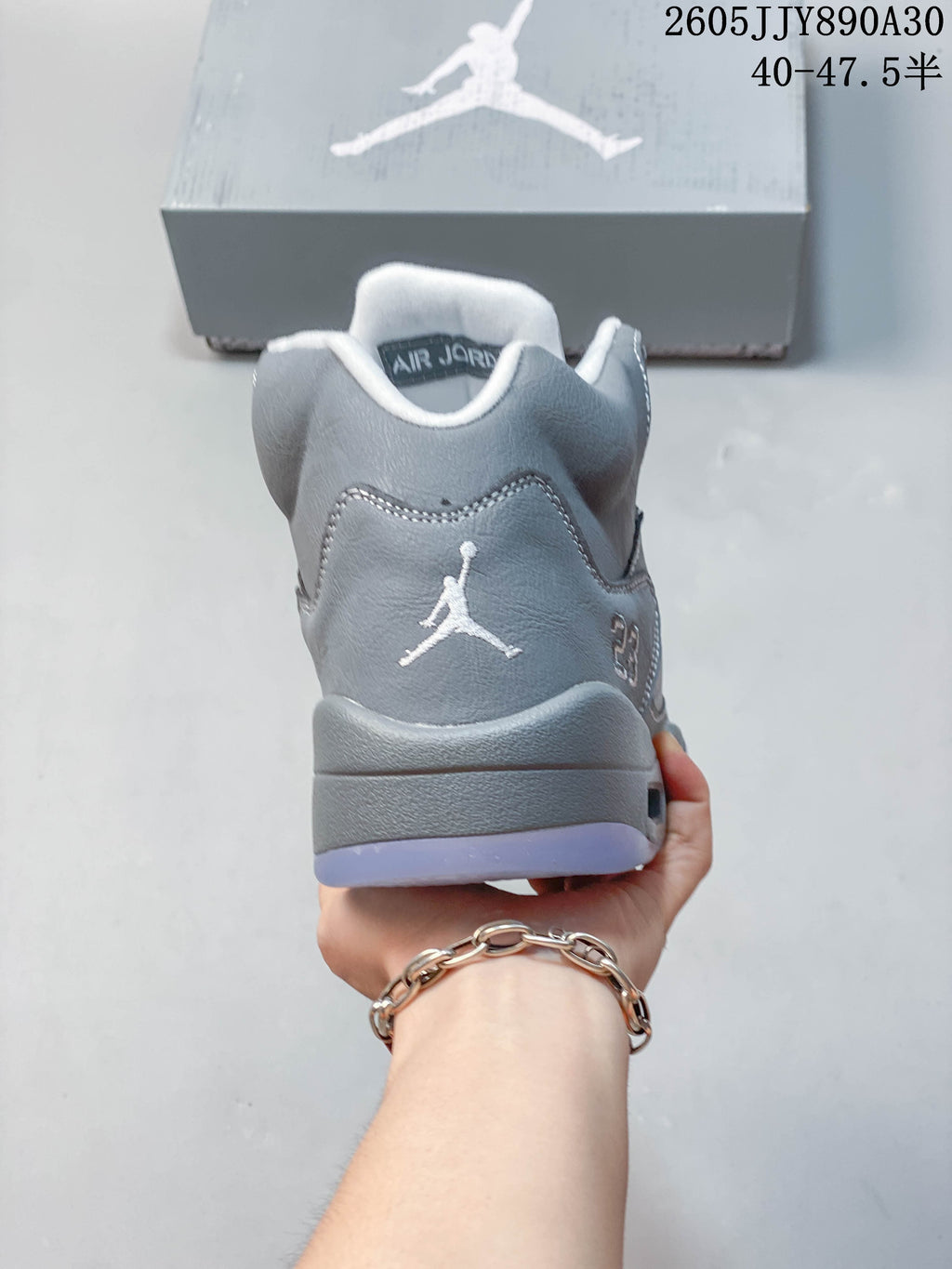 Rear view of a grey Jordan Air Jordan 5 Retro sneaker