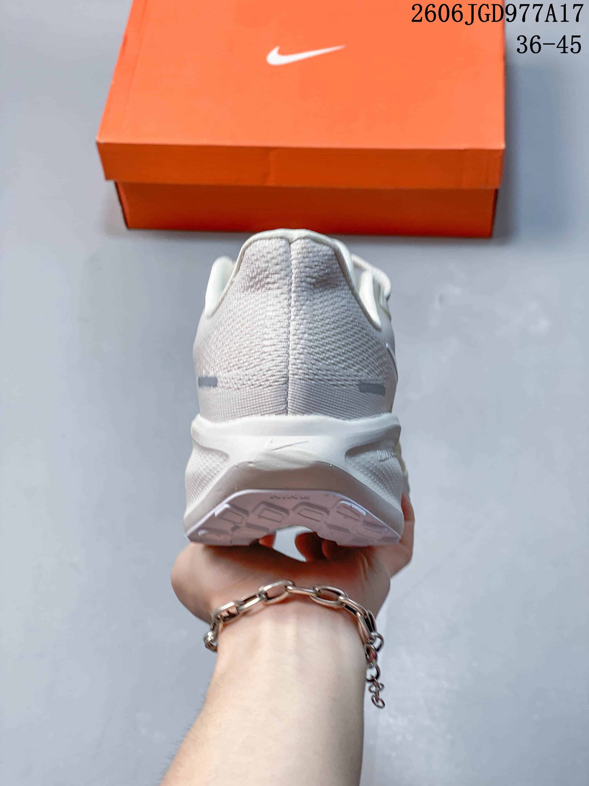 Rear view of an off-white Nike Air Zoom Pegasus 41 shoe with a padded heel.