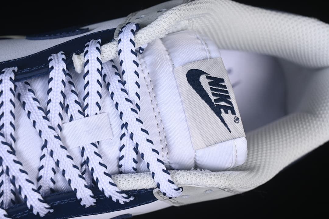 Top-down detail of the tongue, collar, and contrast laces