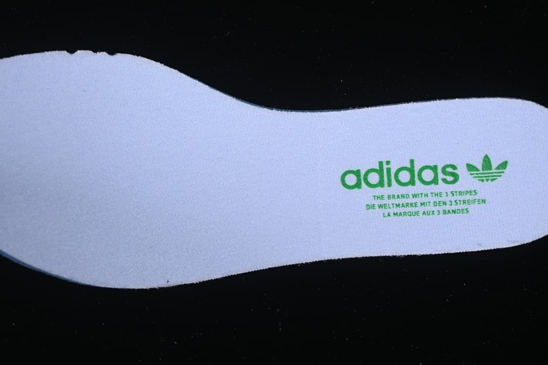 White insole with green adidas branding