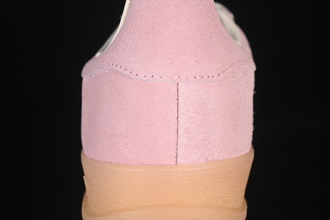 Rear view of the pink sneaker showing the heel and gum-tone sole