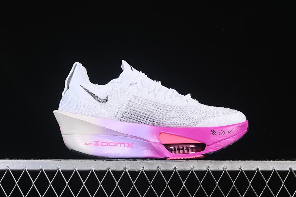 Side profile of a white shoe with lilac and bright pink midsole accents.