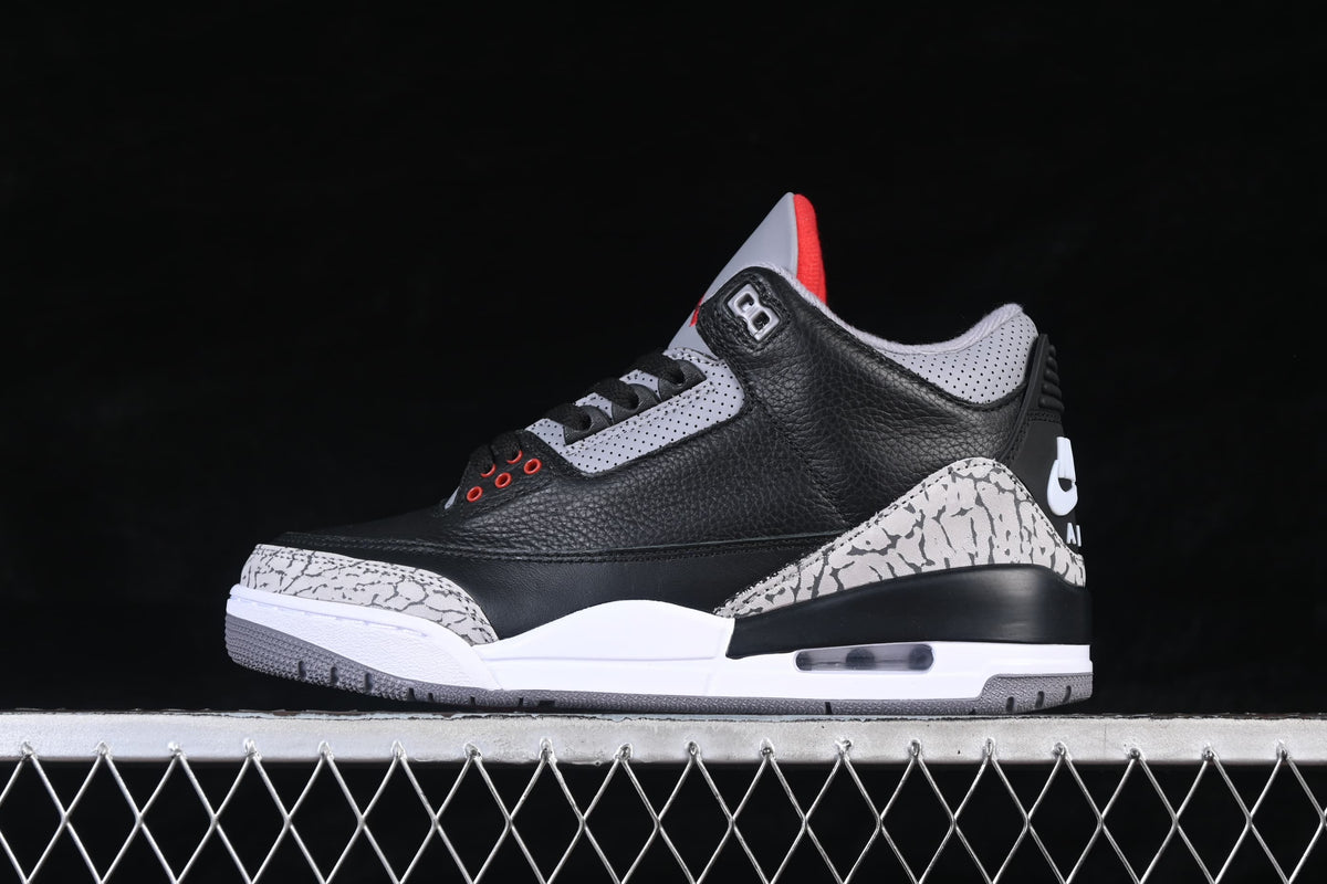 Side profile of the black, grey and white Air Jordan 3 sneaker