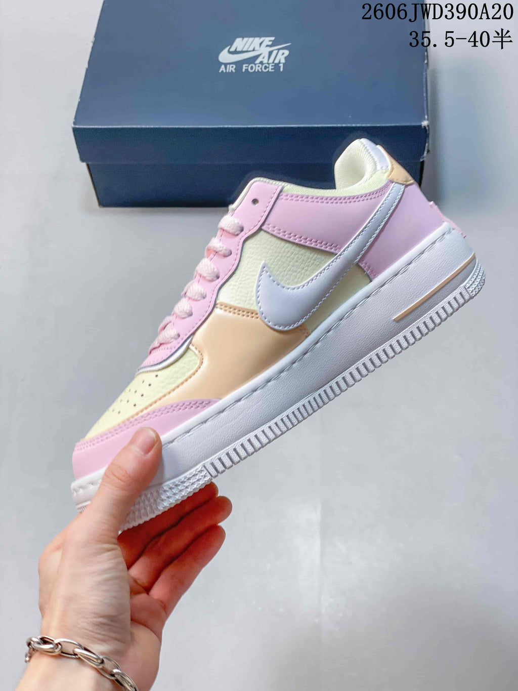 Side view of a pastel Nike Air Force 1 low-top sneaker with a white Swoosh and white outsole.