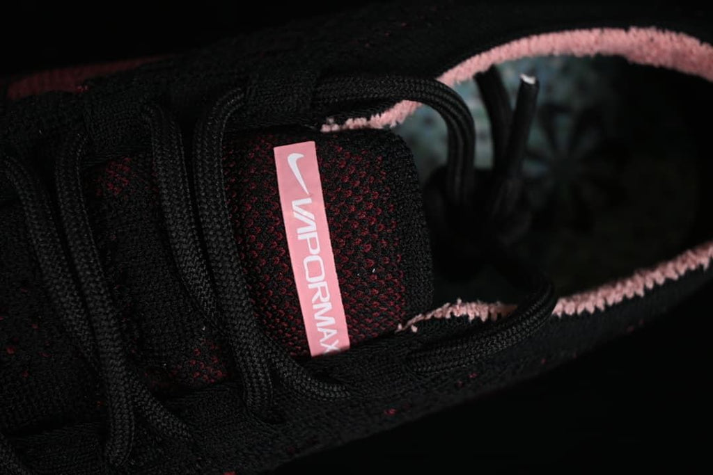Close-up of the laces, knit tongue, and VaporMax tongue label