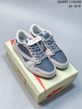 Pair of gray and dark blue low-top sneakers with patterned side panels, displayed on a shoe box