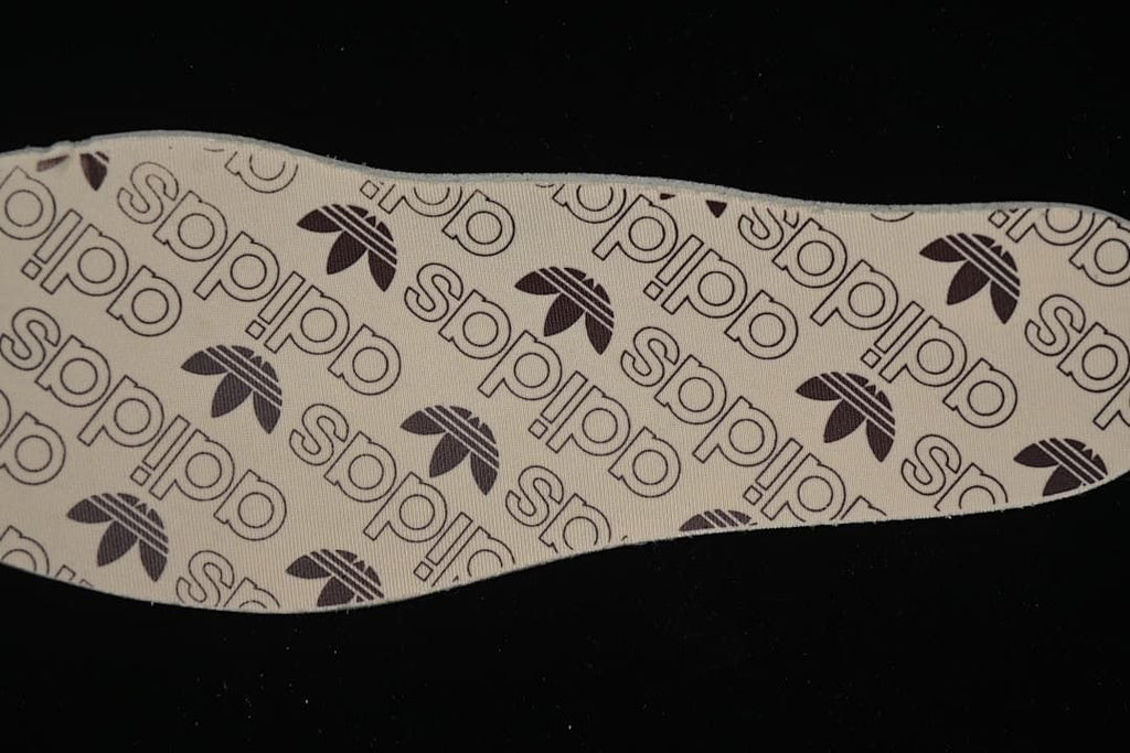 Close-up of the insole printed with adidas and Trefoil branding.