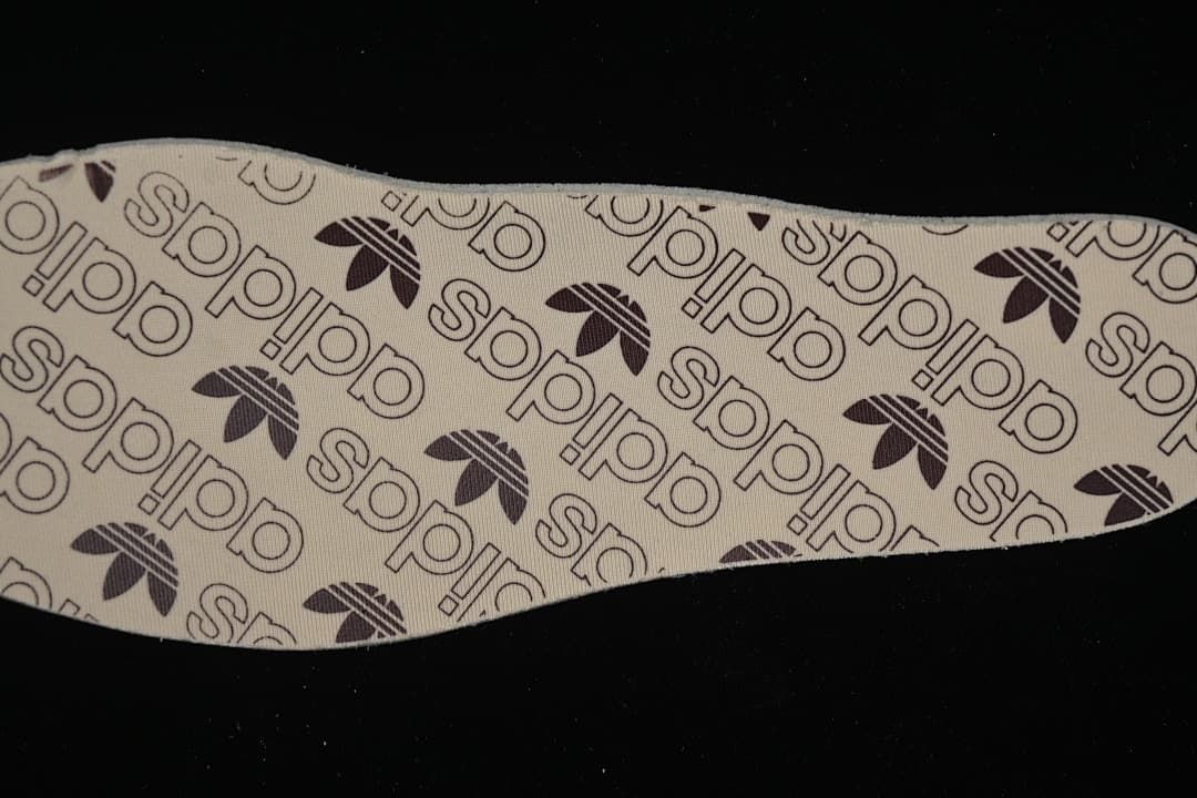 Close-up of the insole printed with adidas and Trefoil branding.