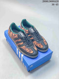 Pair of leopard-print adidas Samba OG low-top sneakers with dark overlays and gum-tone soles