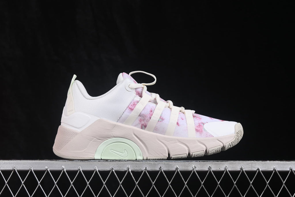 Side profile of the sneaker showing the layered upper, structured side supports, and segmented pale outsole.