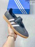Dark gray adidas Samba Jane sneaker with white stripes, a hook-and-loop strap and gum outsole