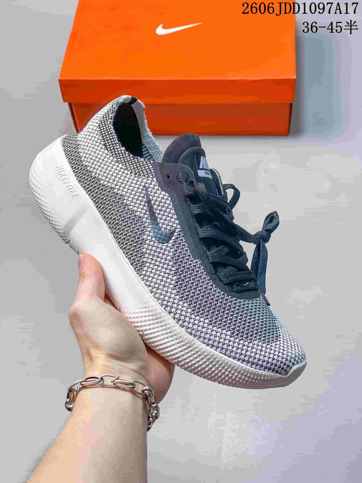 Dark gray Nike Free 2025 low-top shoe with a white sole.