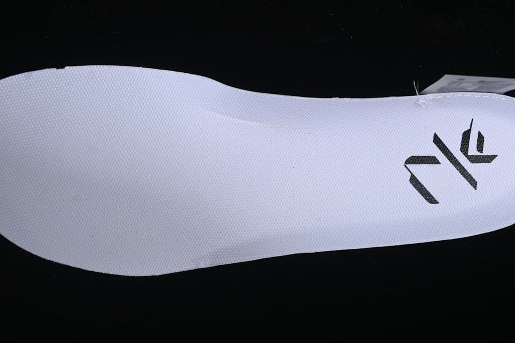 Close-up of white insole with black graphic