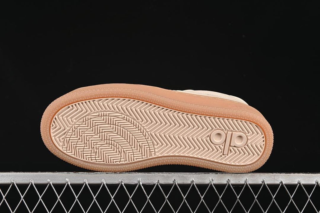 Underside view showing patterned tread and embossed Alo branding
