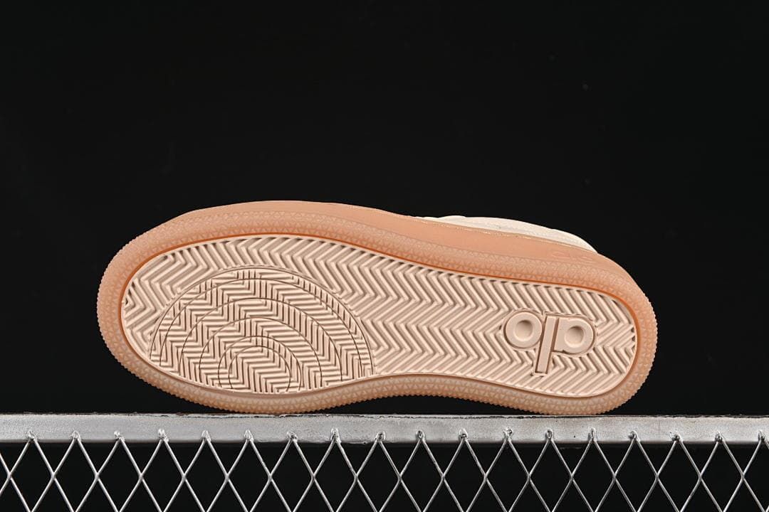 Underside view showing patterned tread and embossed Alo branding