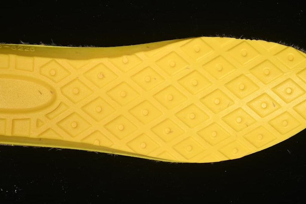 Close-up of the yellow-patterned boot outsole