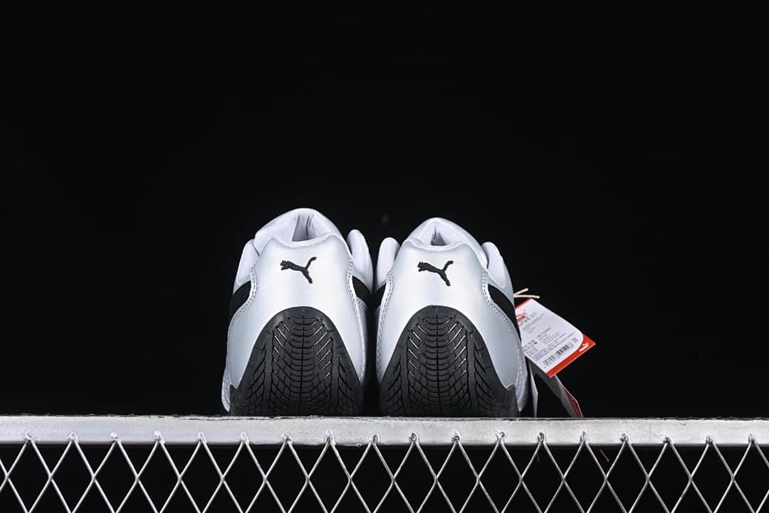 Rear view of both shoes showing Puma heel logos and black outsole patterns.