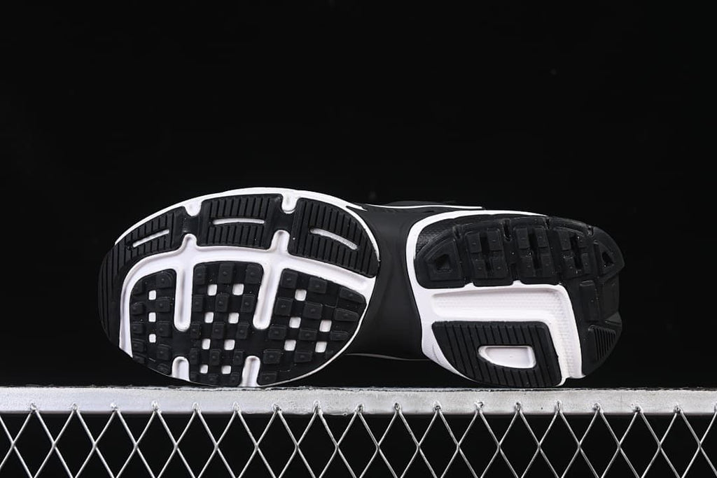 Outsole view showing black tread and white sections.