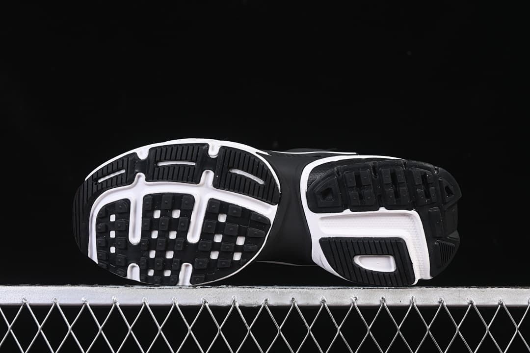 Outsole view showing black tread and white sections.