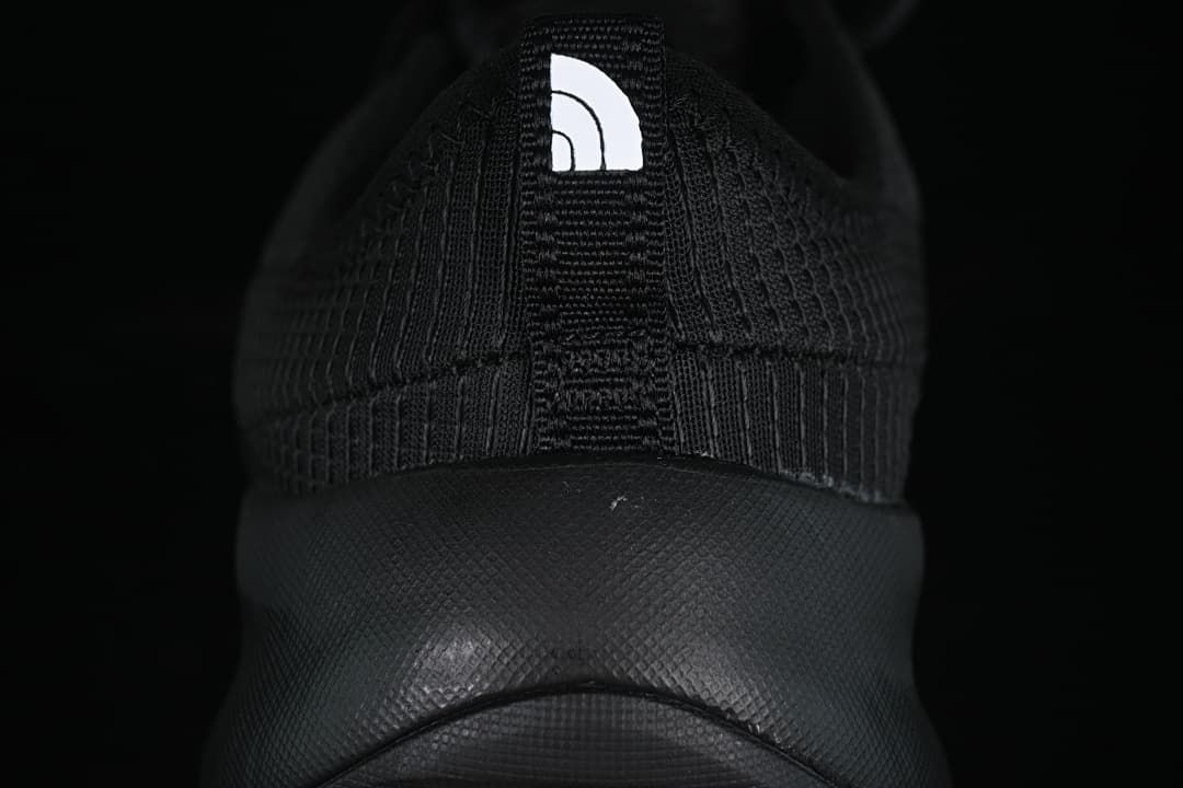 Rear view of the shoe with heel pull tab and logo