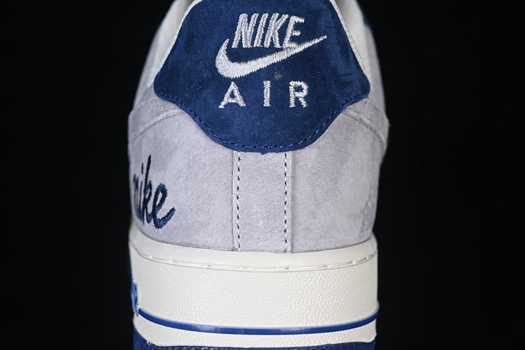 Rear view showing the navy heel tab and gray heel panels.