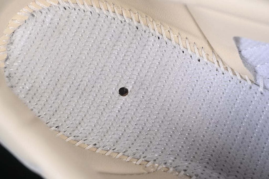 Close-up of the shoe's interior construction beneath the insole
