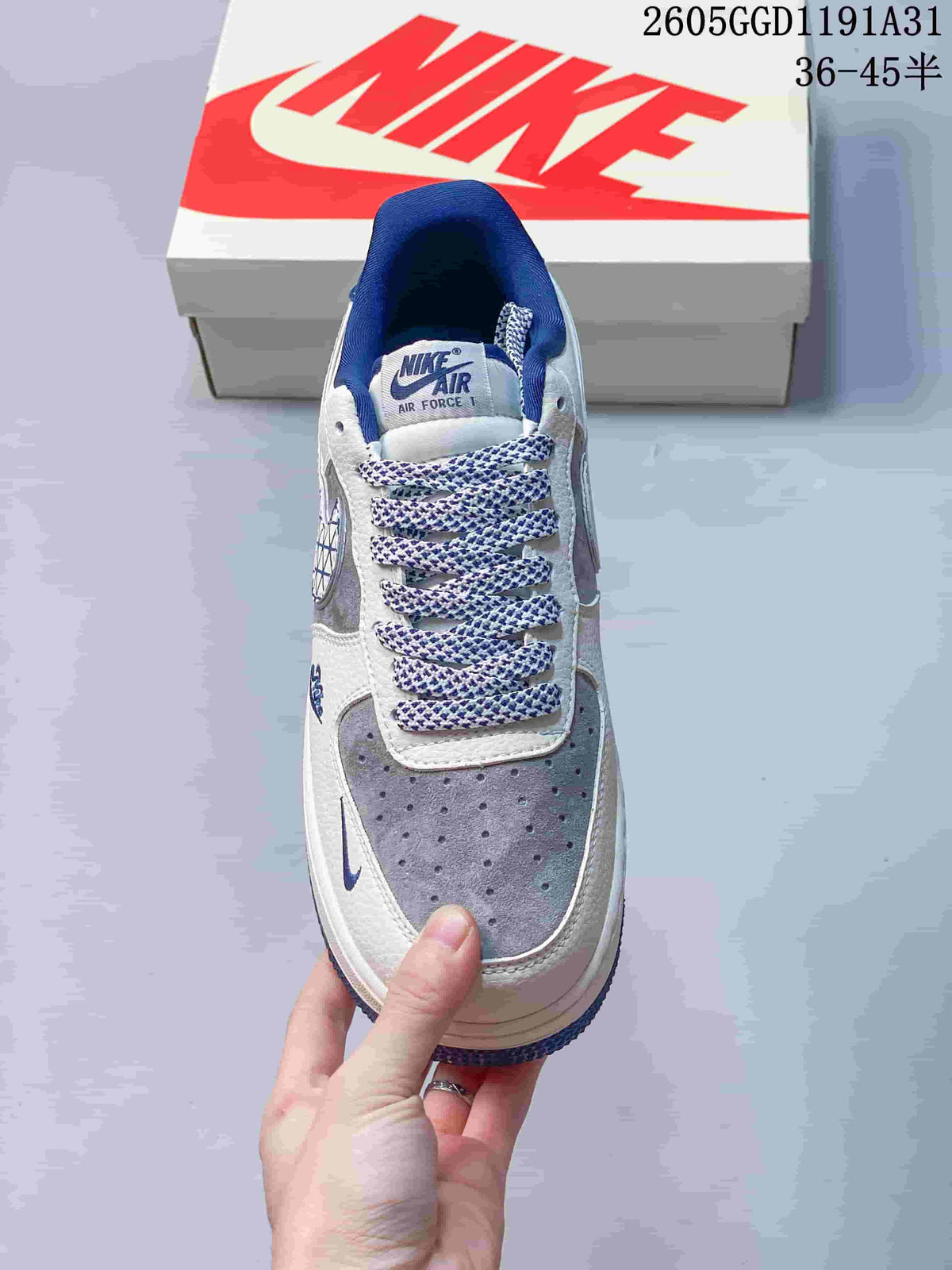 Top view showing the perforated grey toe, patterned laces and blue collar lining.