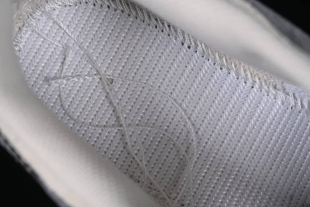 Detail of the insole stitching and textured surface