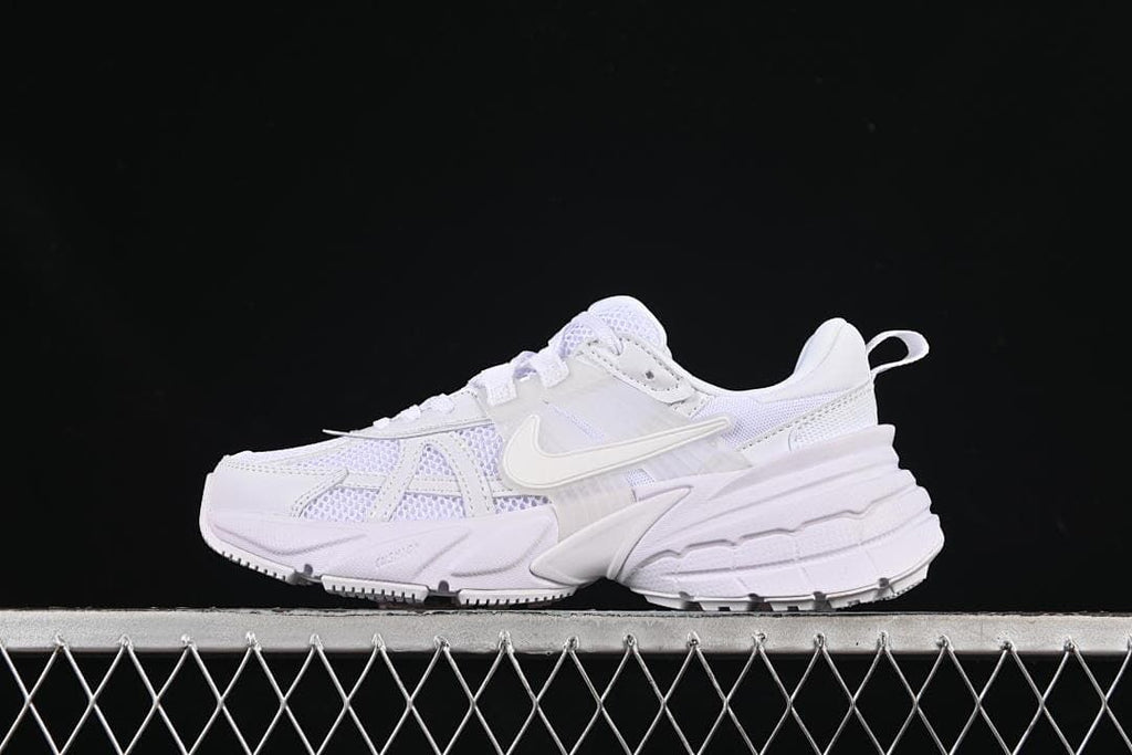 White Nike V2K Run sneaker shown in side profile.