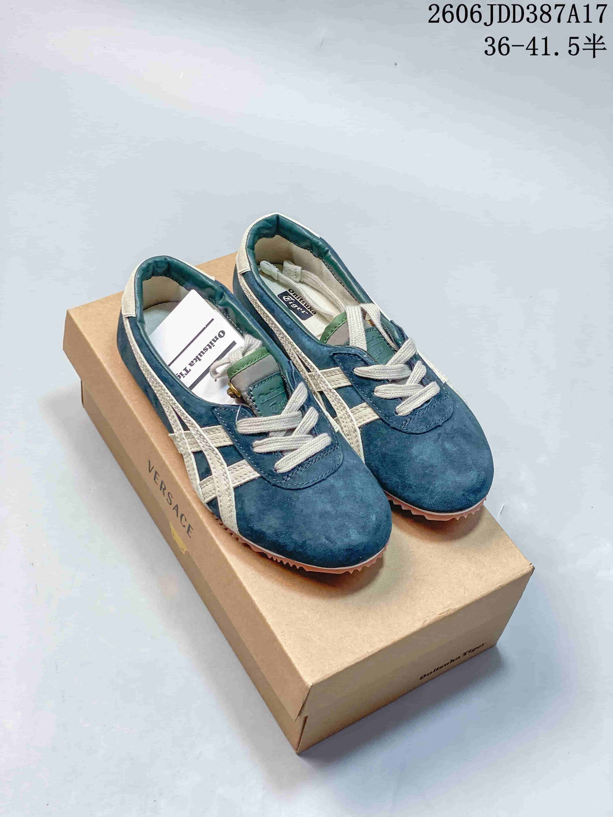 Pair of blue low-top sneakers with cream side stripes and laces.