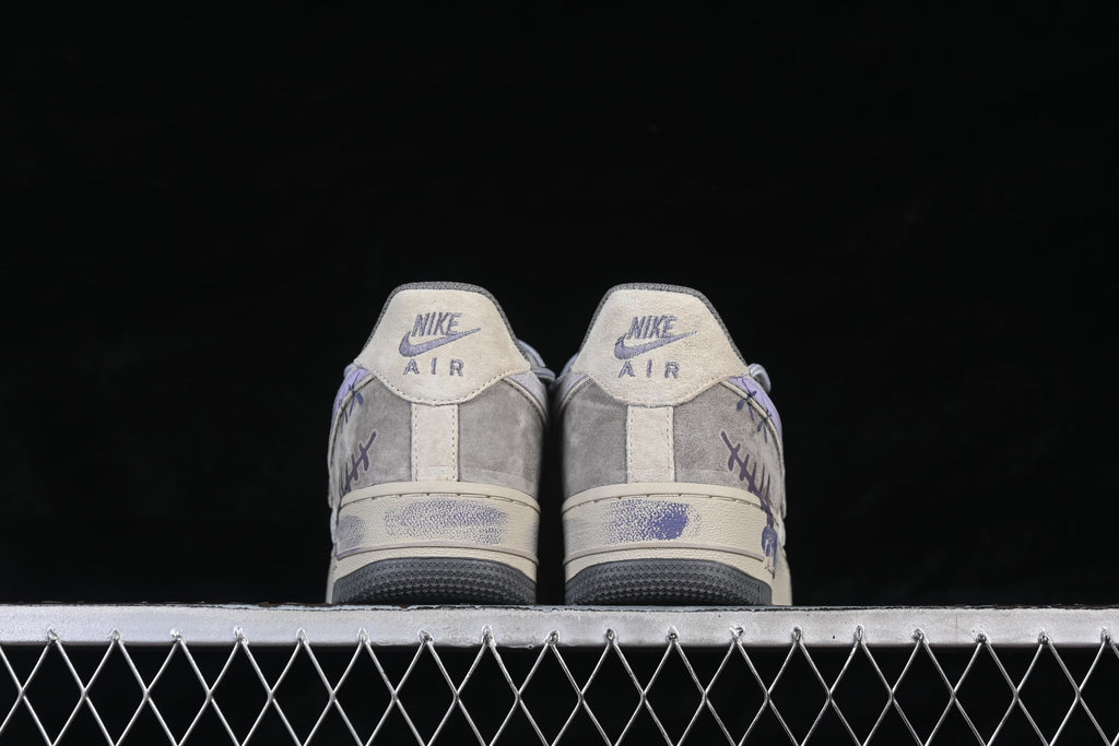 Rear view of the pair showing heel tabs and graffiti details