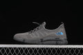 Side view of a gray The North Face 8912 shoe with blue logo accents and a dark grooved outsole