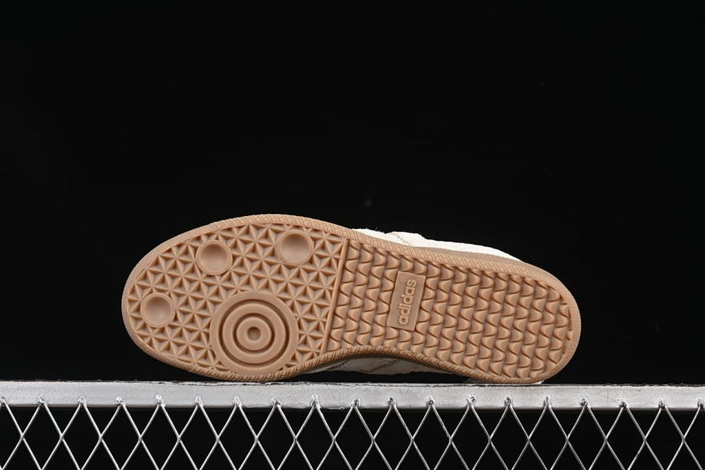 Underside view showing the gum-tone outsole and its patterned tread.