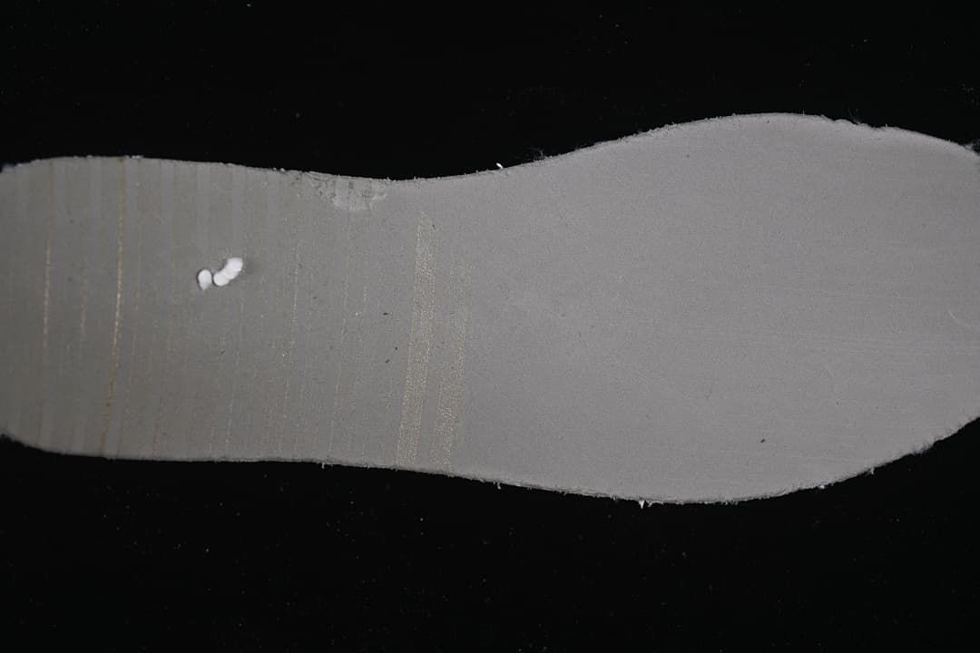 View of the gray underside of the shoe's insole