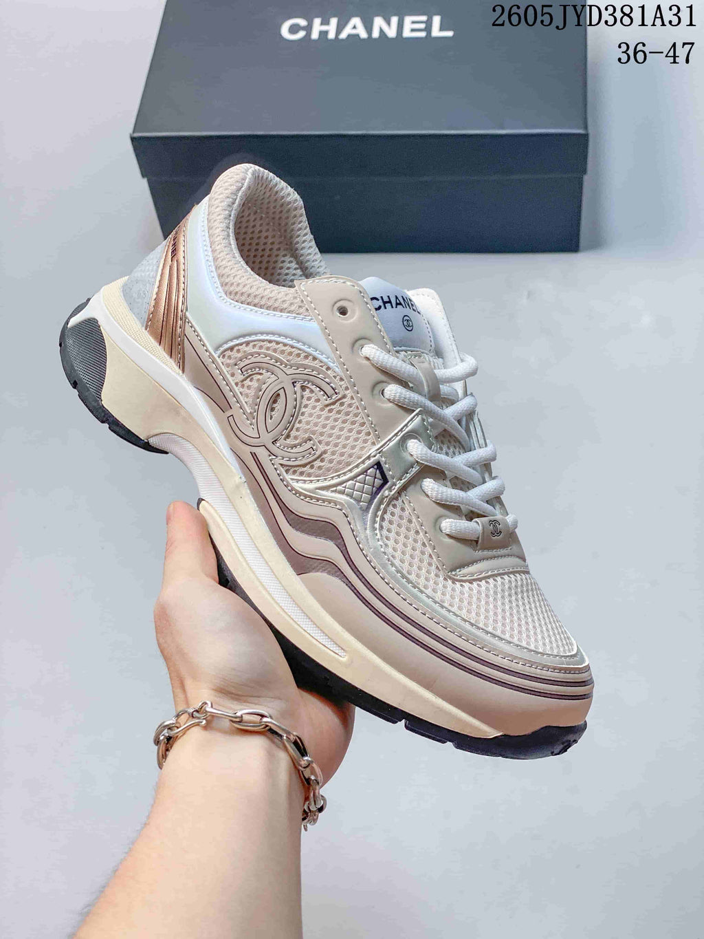 Angled side view showing the sneaker's bow-inspired side motif and cream platform-style sole
