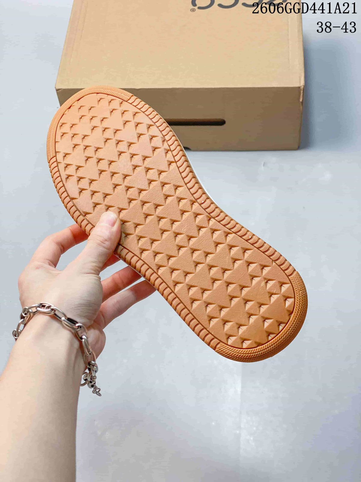 Close-up of the brown textured outsole on the ECCO sneakers.