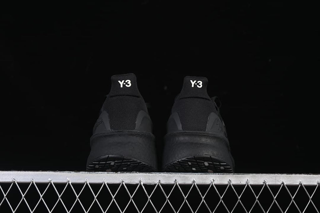 Rear view of the pair showing Y-3 heel tabs.