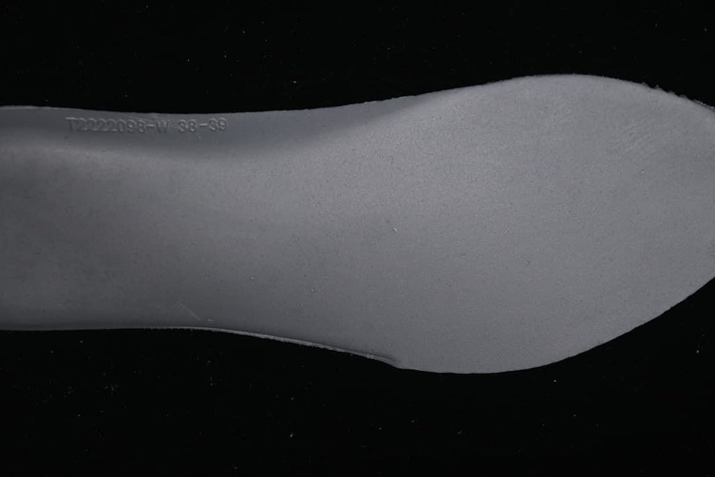 Close-up of the shoe insert edge with embossed markings