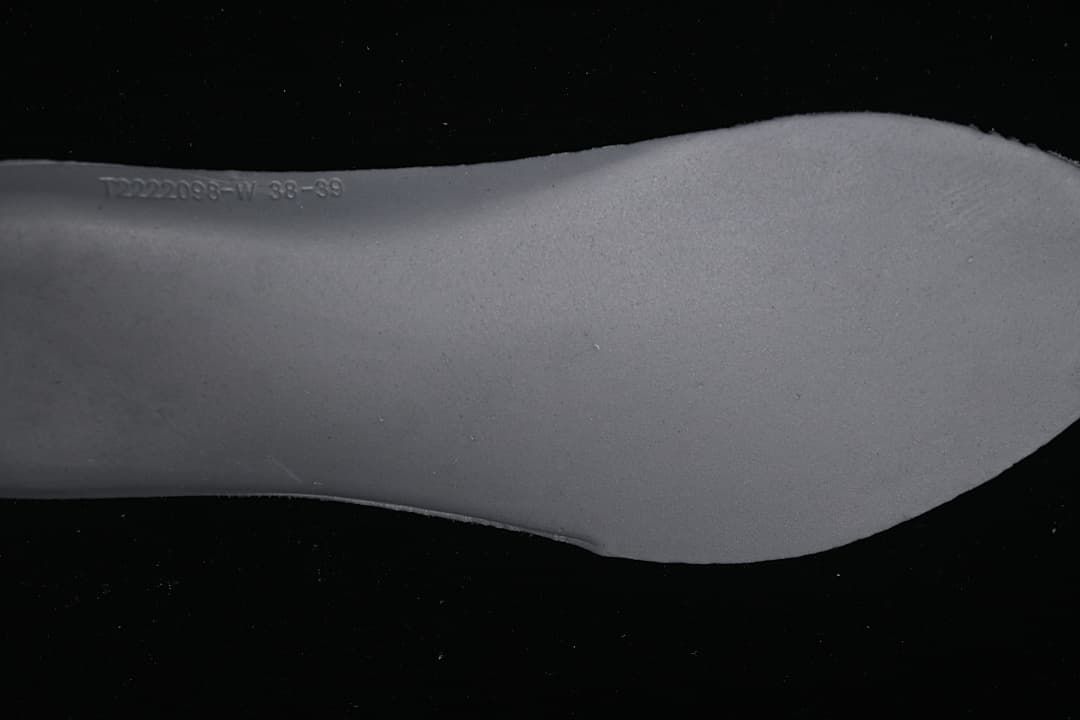 Close-up of the shoe insert edge with embossed markings