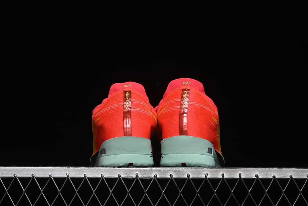 Rear view of both shoes showing the heel details.