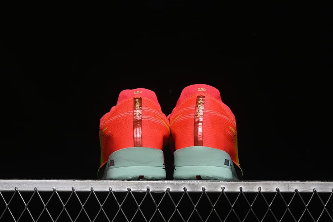 Rear view of both shoes showing the heel details.