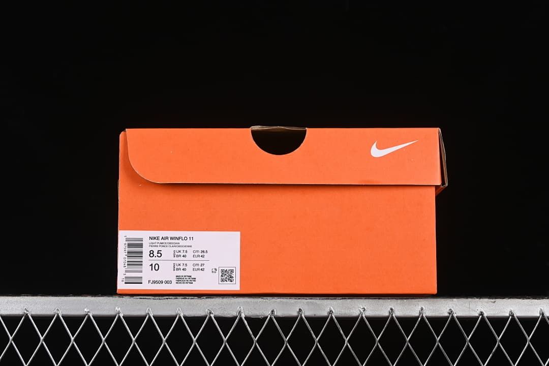 Orange Nike shoe box showing the label for Nike Air Winflo 11, style code FJ9509-003, and EU size 42