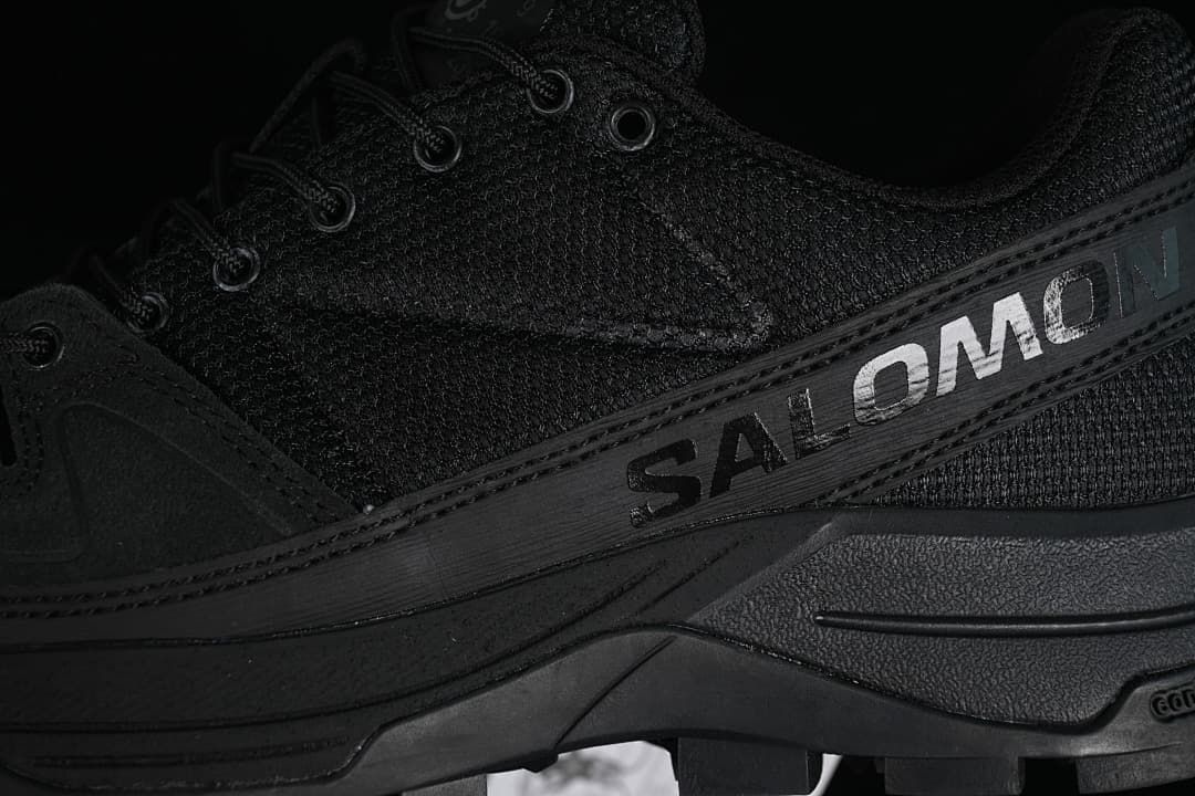 Close-up of Salomon branding on the black side panel