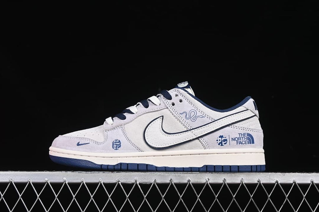 Side view of the sneaker highlighting the Swoosh and Snake Year graphics.