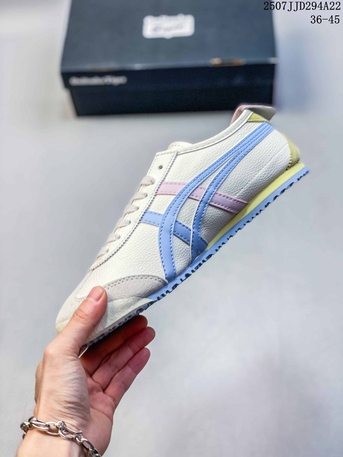 Side view of a cream sneaker with blue stripes, pink accents, and a pale yellow midsole detail
