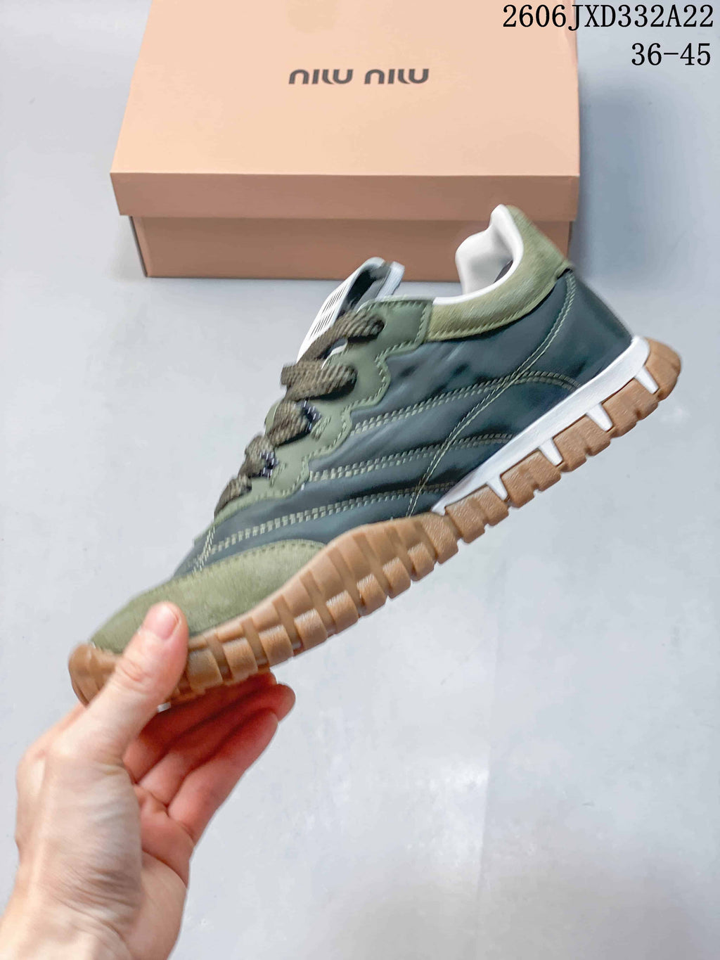 Side profile showing the green and gray panels and chunky tan outsole
