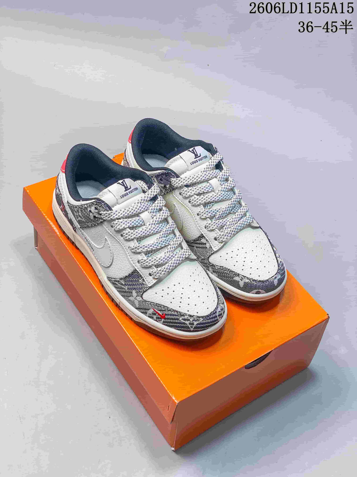 Pair of white and patterned low-top sneakers with braided laces on an orange box